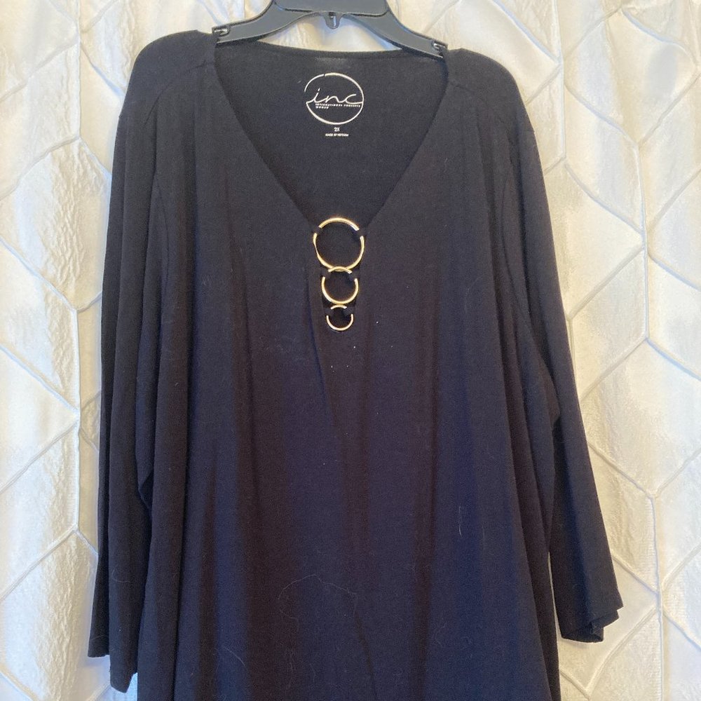 Black top with vee neck and gold ring detailing